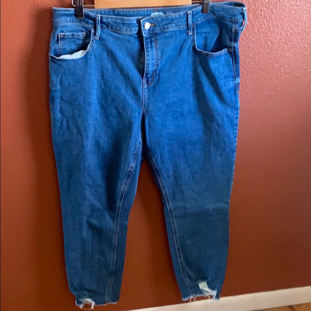 Medium wash cropped jeans with distressed legs